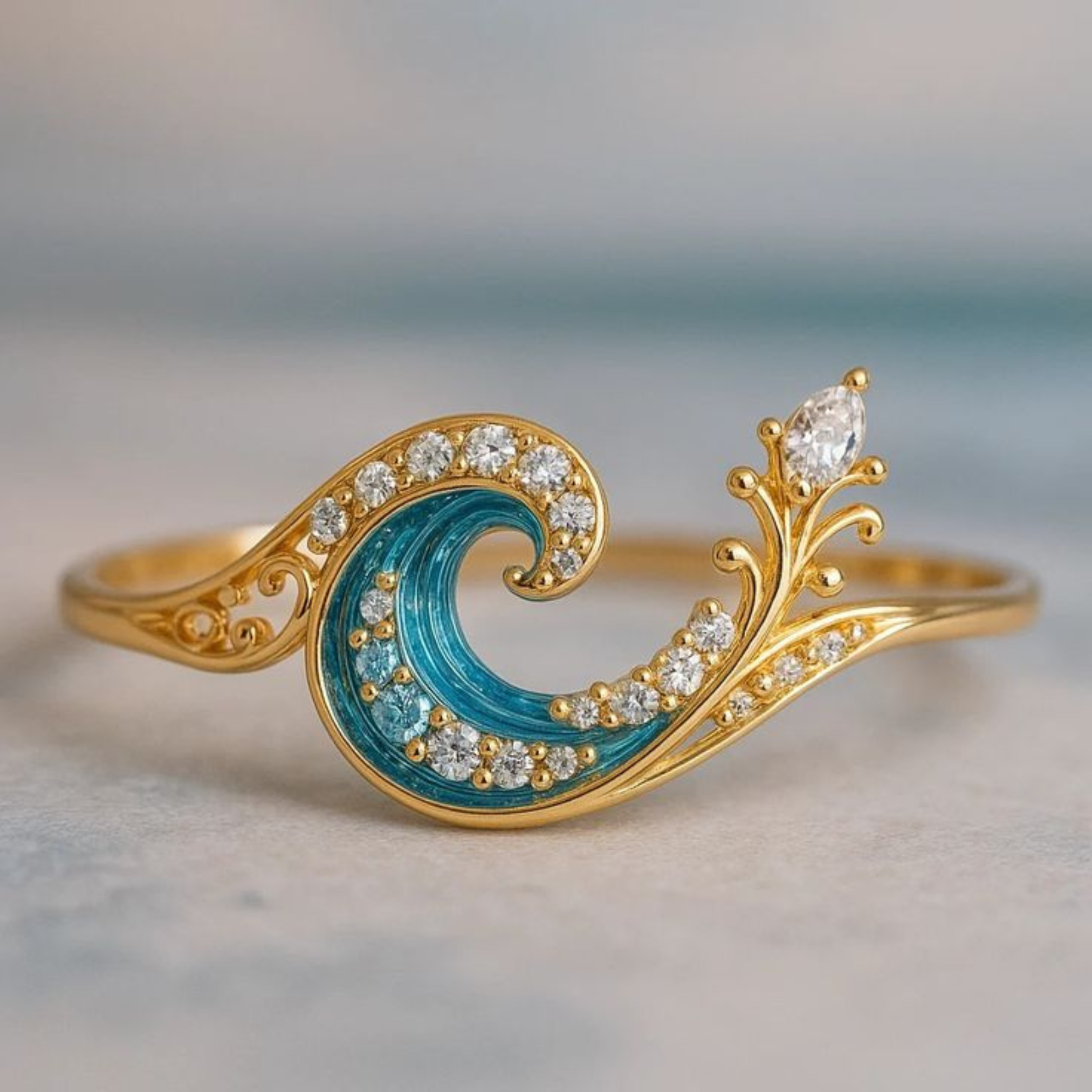 Gold ring with blue wave design and diamond accents on a light background